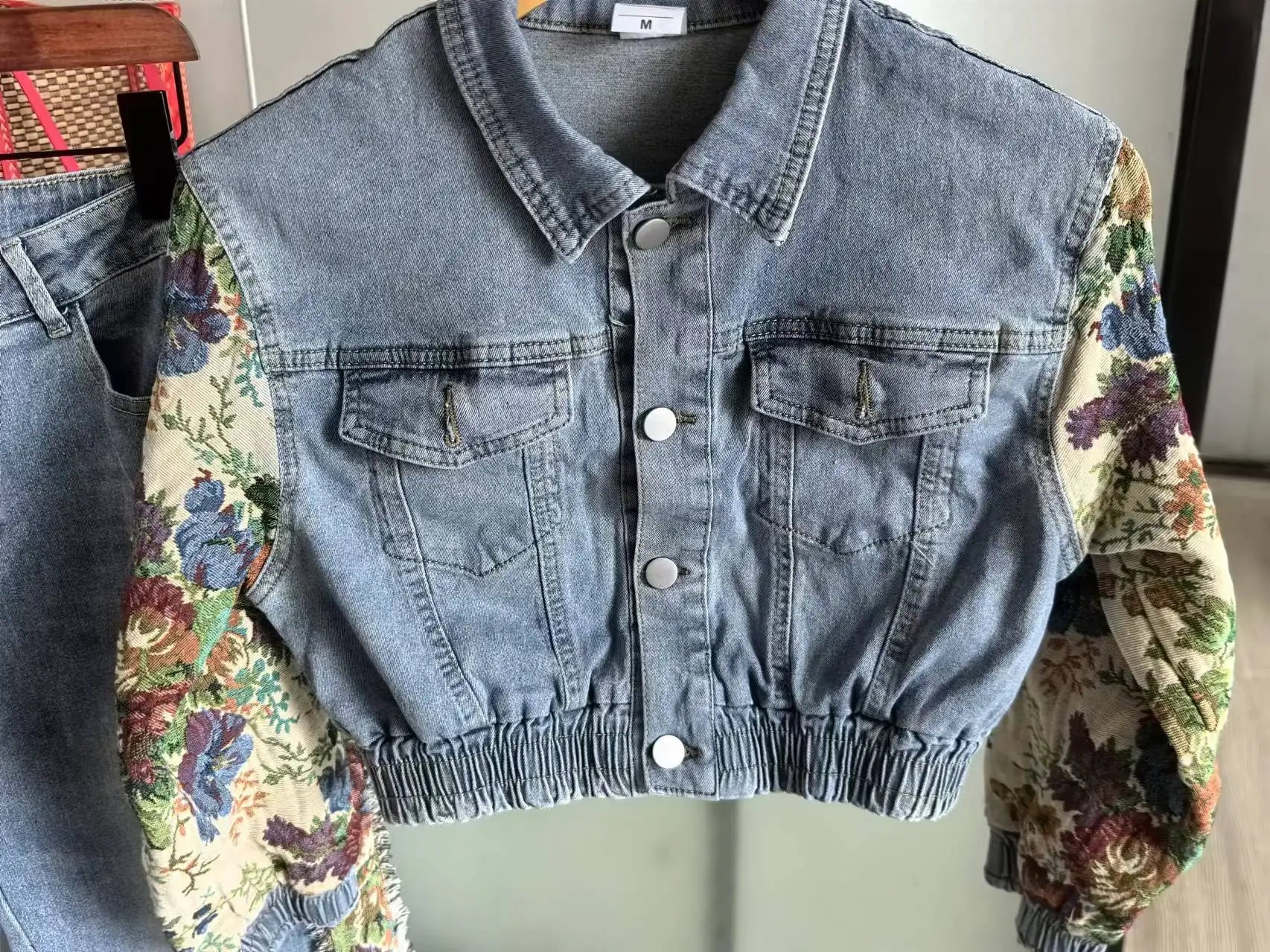 Denim Blossom Beauty: The Rebel Petal Jacket & Ripped Jeans Ensemble