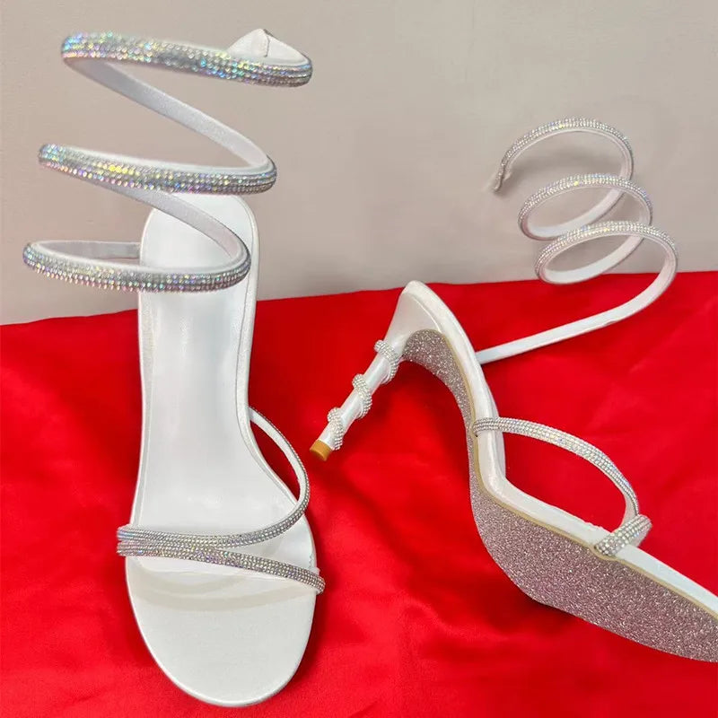 SerpentSlay Strut: The Luxe Crystal Coil Stilettos