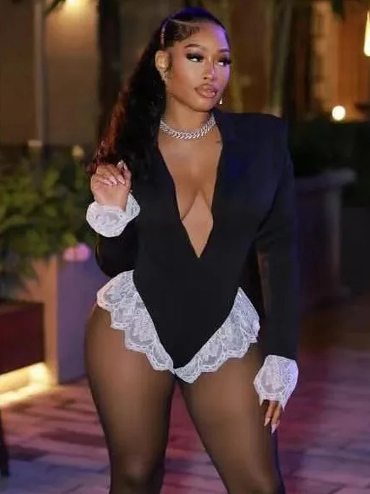 Person wearing a black outfit with white lace details in an outdoor setting