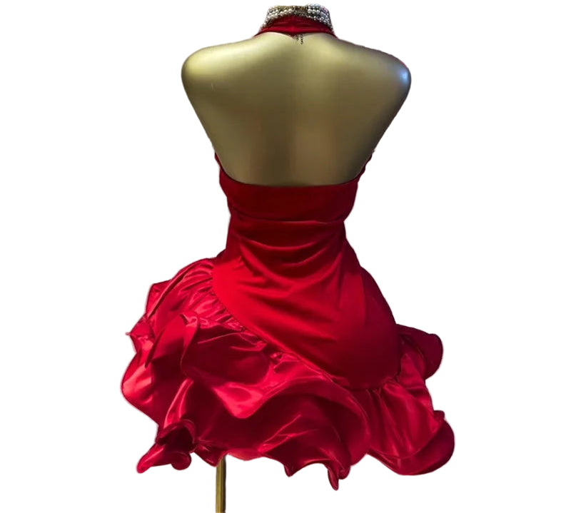 Red dress on a mannequin with GLCMYAYA branding in the background