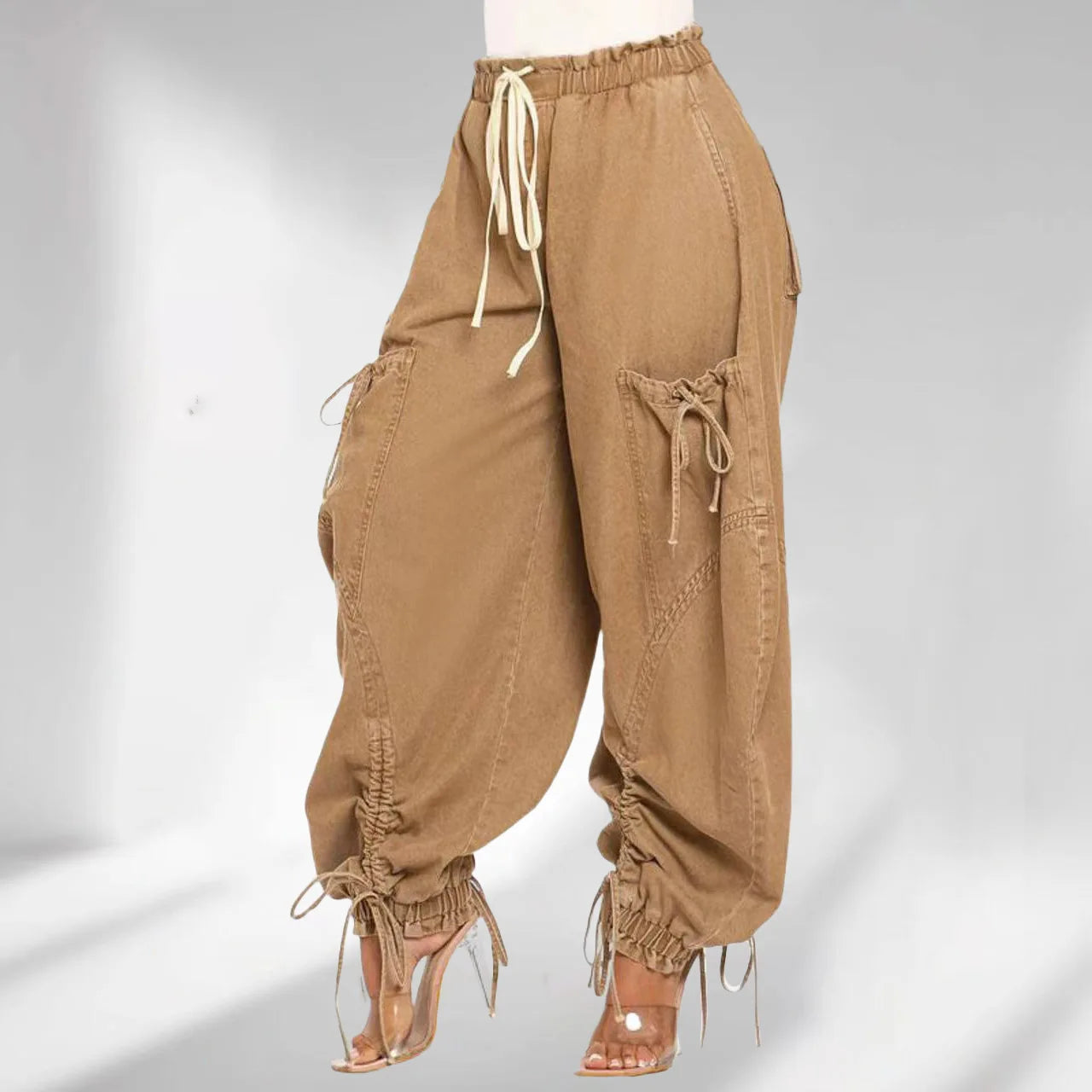 Brown baggy pants with drawstrings on a white background