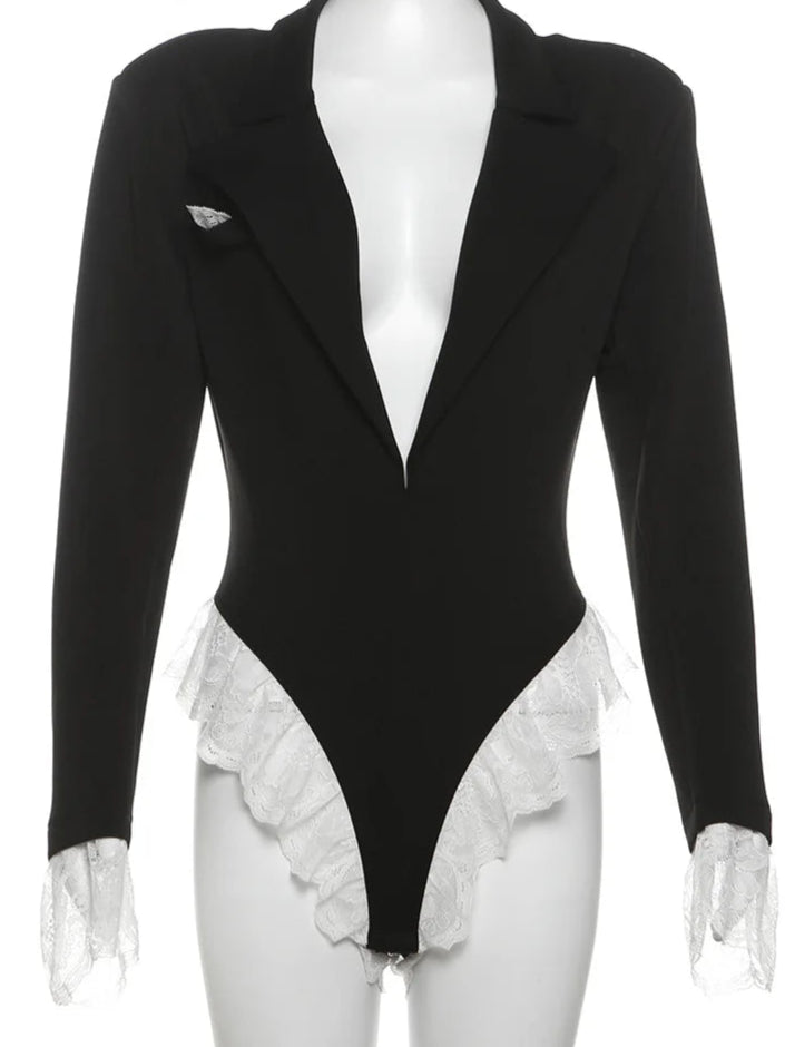 Black bodysuit with ruffled details on a mannequin against a white background