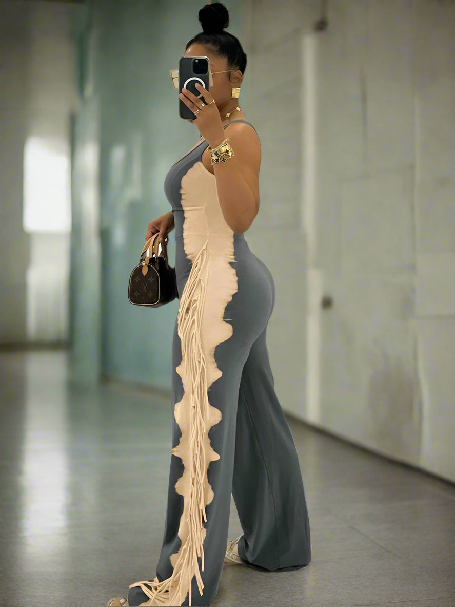 Woman in a stylish outfit with a long, flowing dress in an indoor setting.