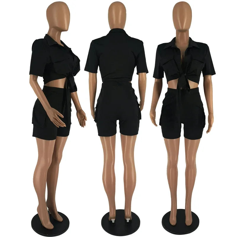 Black outfit on mannequins from front, side, and back views.